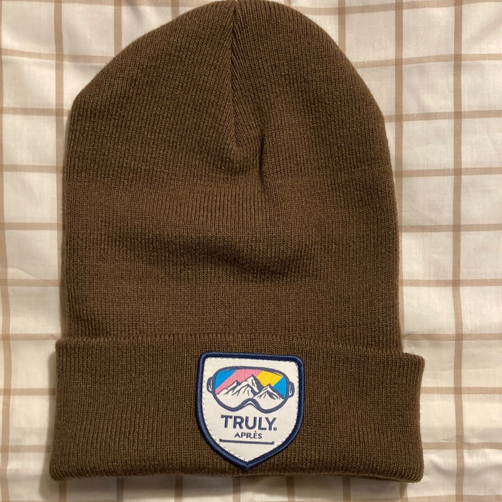 Brand new never worn brown Truly Beanie